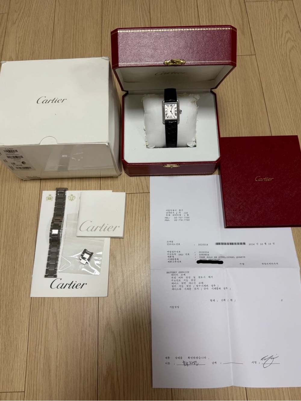 Cartier Tank Watch with Silver Case and Black Leather Strap